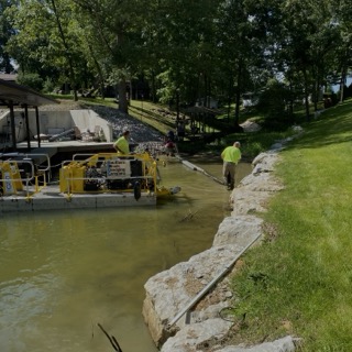 Dredge working a silted pond
